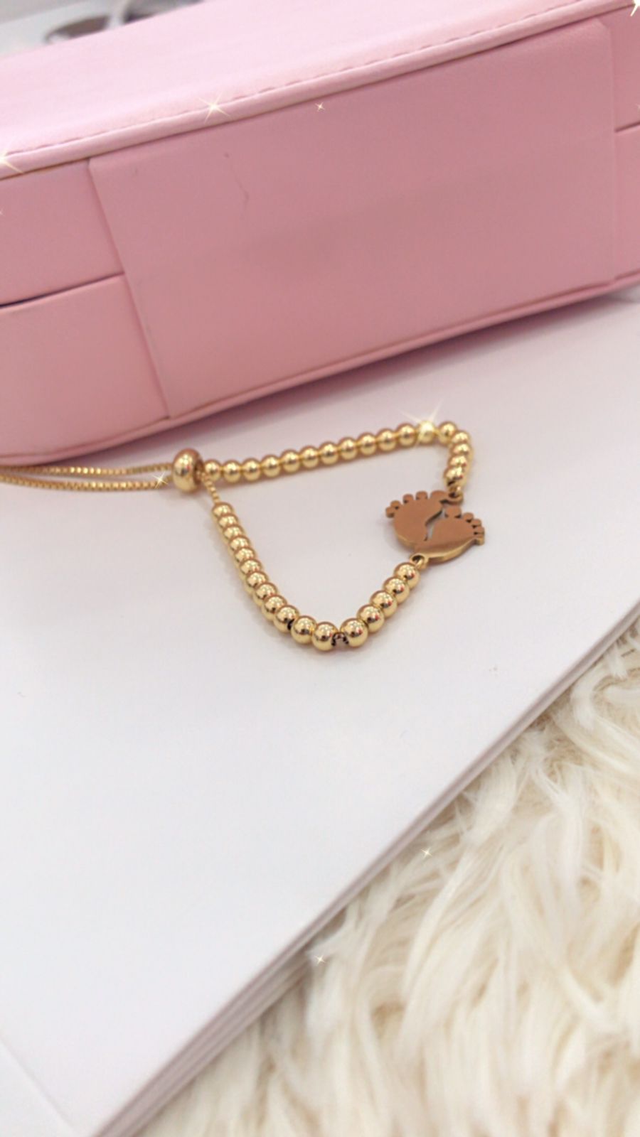 Pulsera con dijes de Piecitos