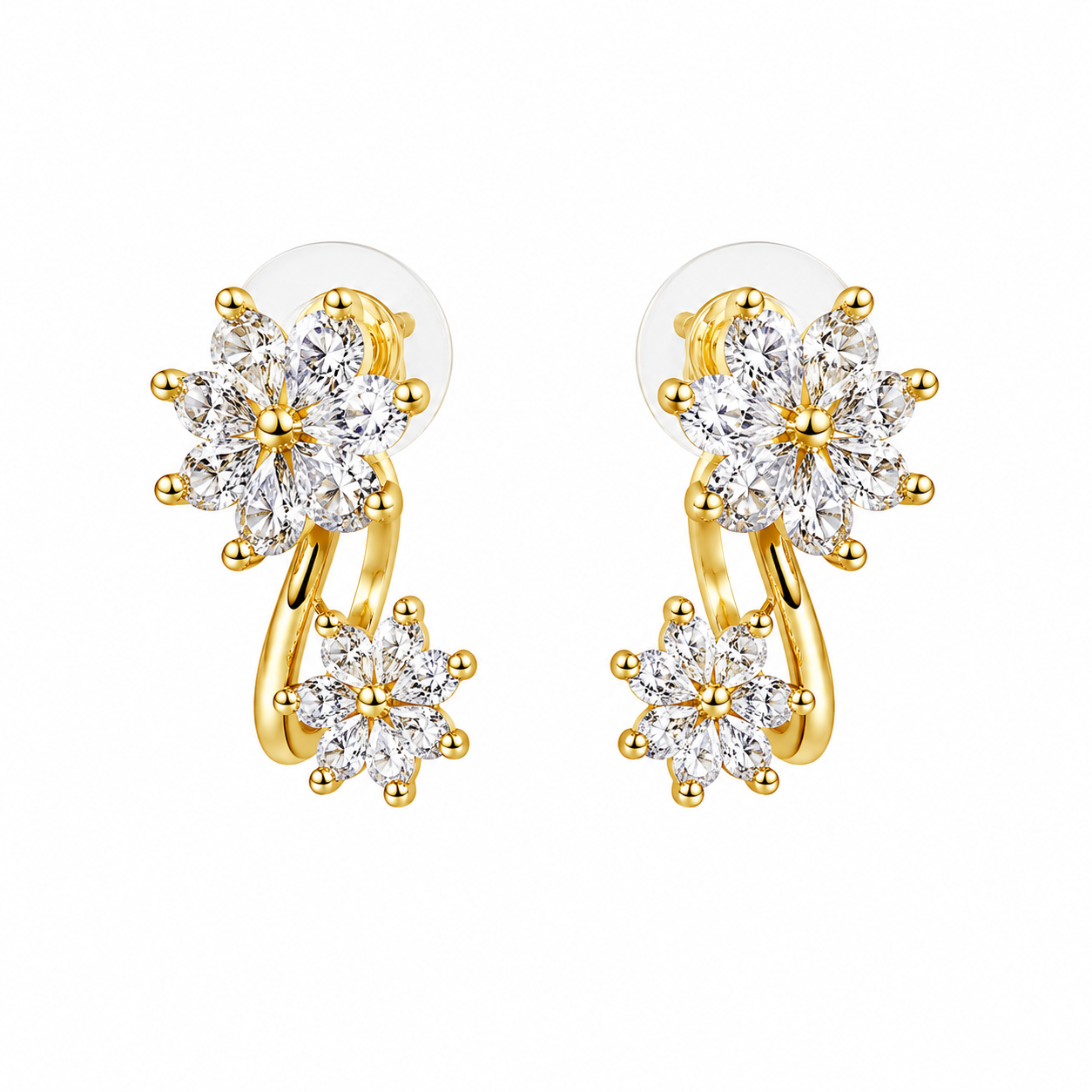 Aretes de doble flor elaborados con finas circonias y acabado dorado.