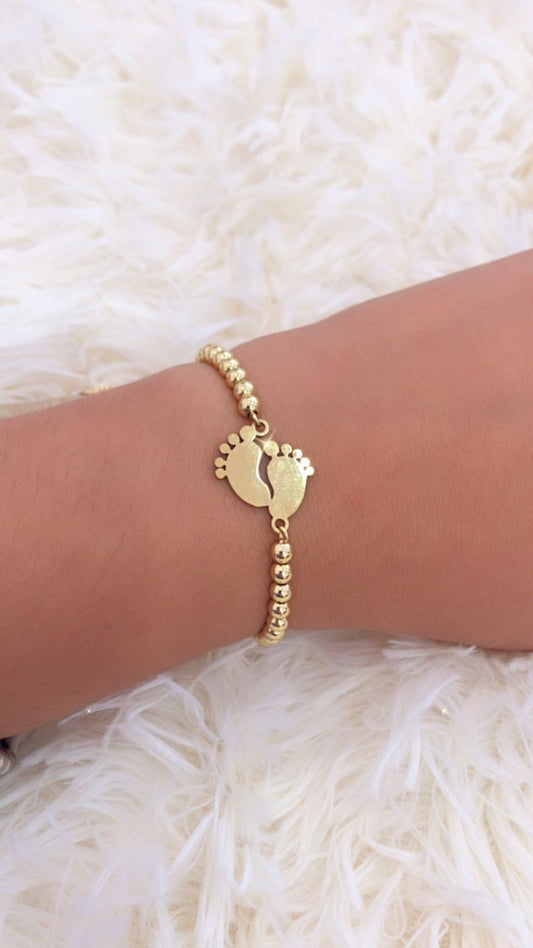 Pulsera con dijes de Piecitos