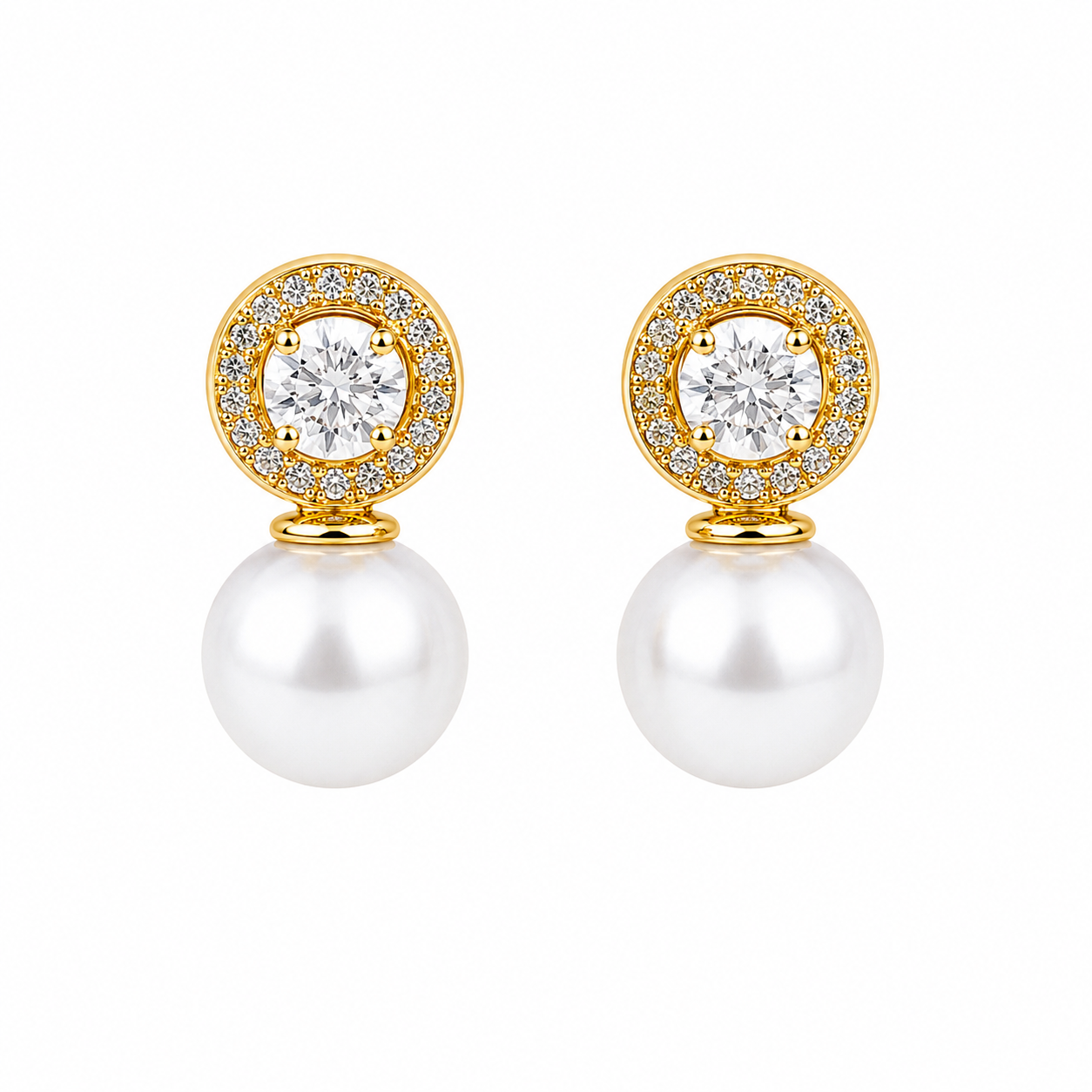 Aretes con perla nacarada y halo de finas circonias.